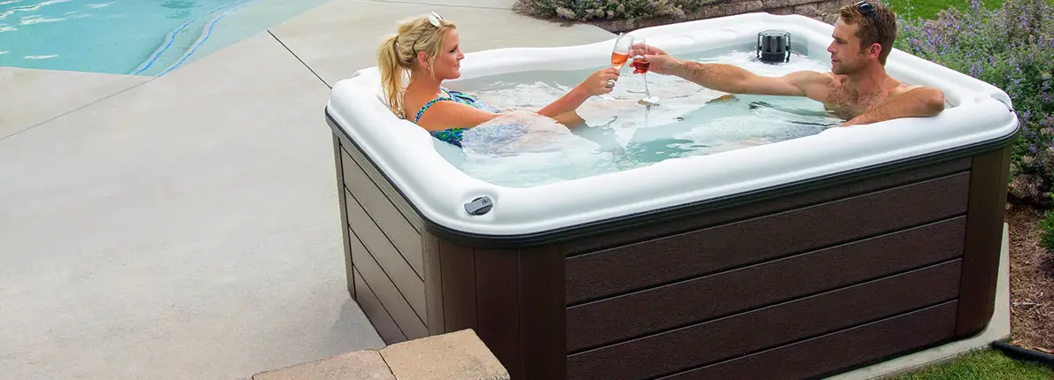 couple relaxing in nordic hot tub